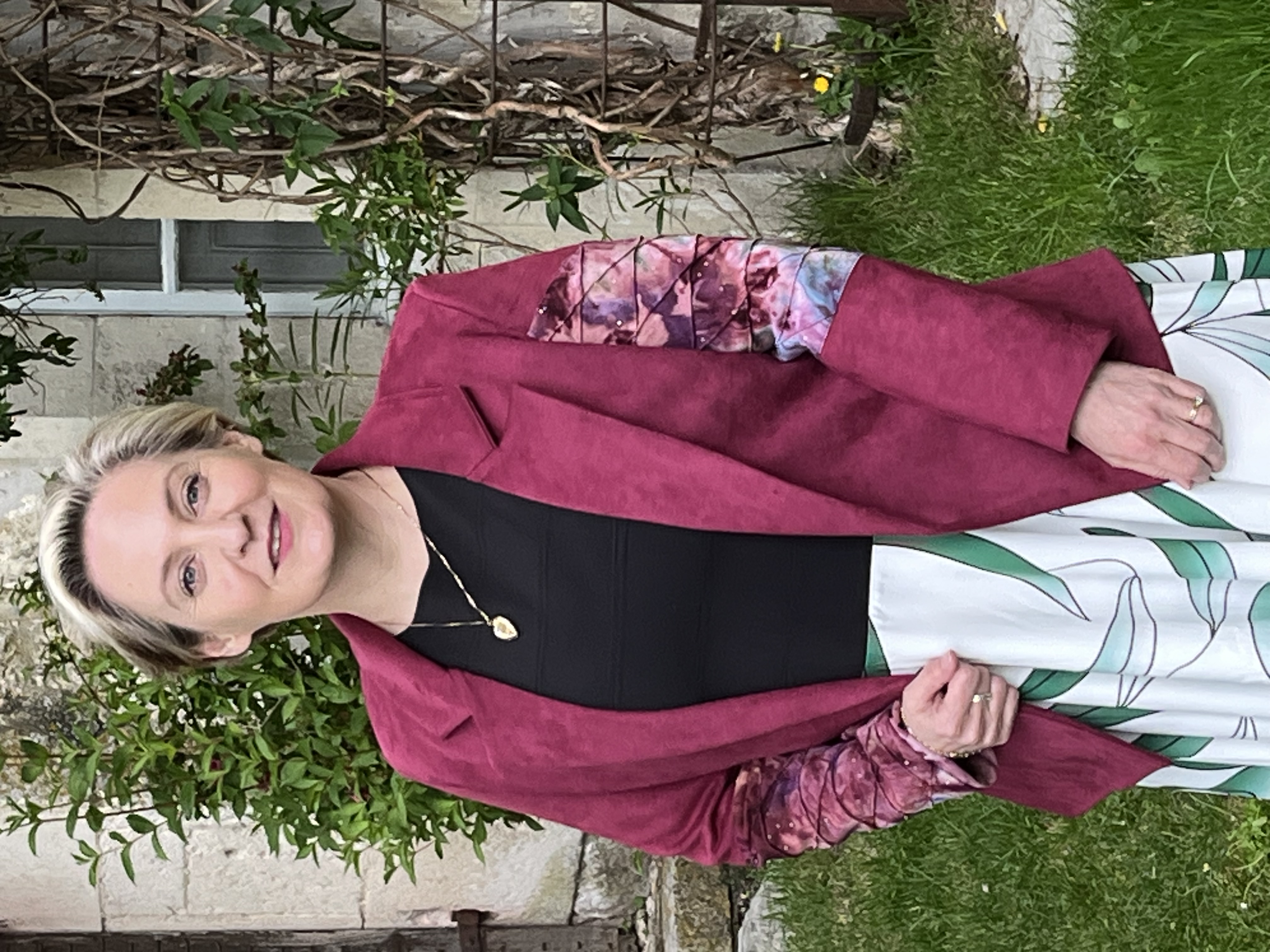 Red velvet jacket and sleeves with patches close up